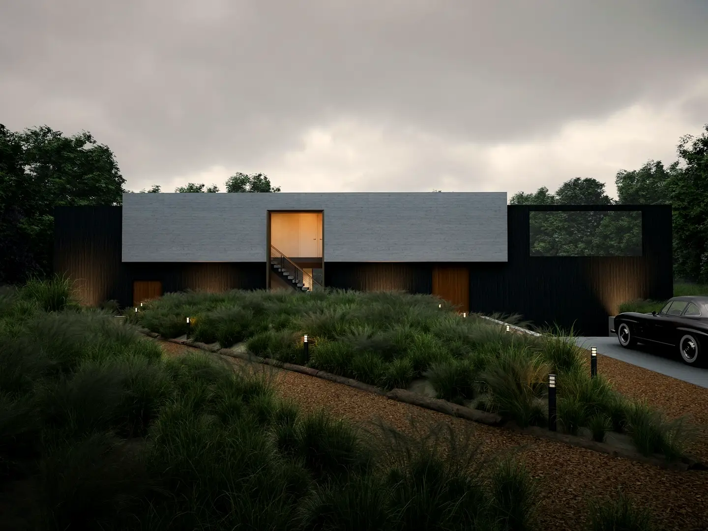 A low modern house at dusk with its windows glowing and landscape lighting along the drive.